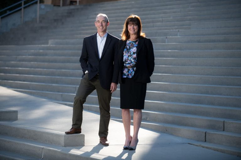 Tom Andriola and Leslie Thompson on the steps of McGaugh Hall 